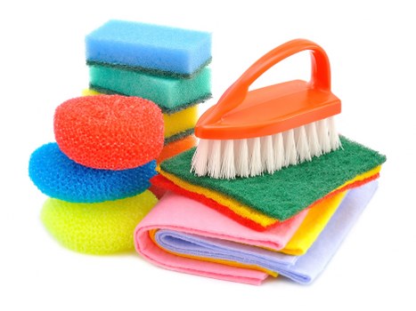 Team member following health and safety procedures during cleaning
